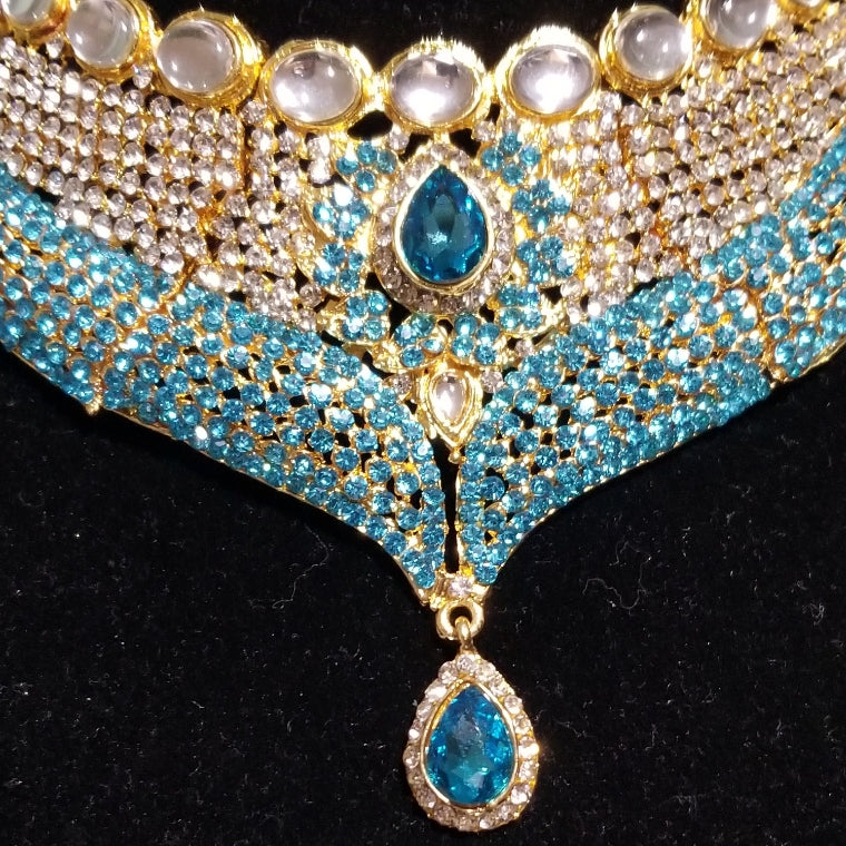 Top quality 22k electroplated Indian costume Jewelry set. 2pc set in choker and drop earrings. Turquoise blue/silver dazzling crystal stones.