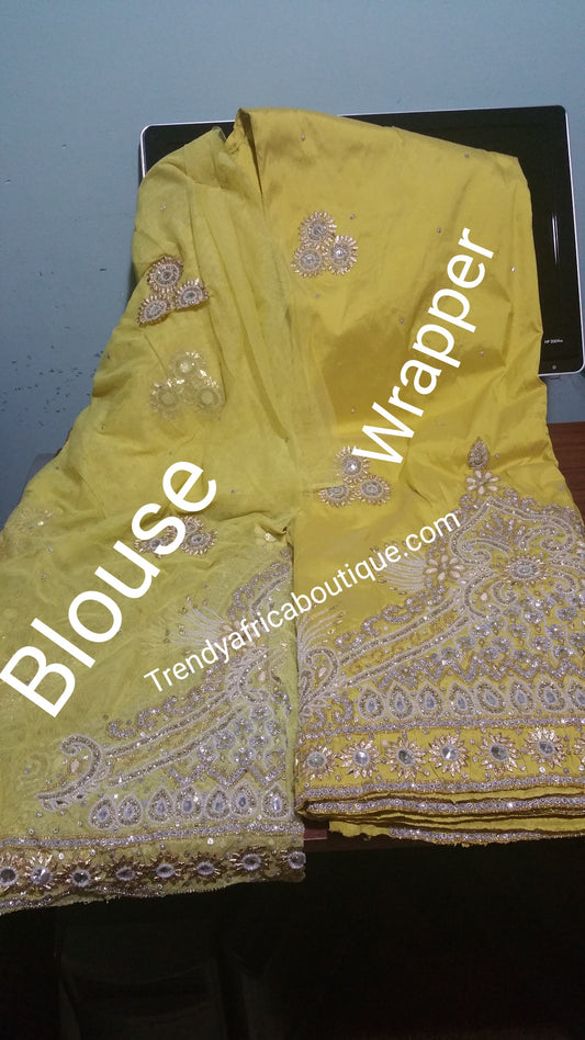 Clearance: Sweet yellow heavily Beaded and Stoned VIP/Nigerian traditional George wrapper. Classic Wrapper for Igbo/Nigerians traditional wedding outfit. Sold as 2 wrapper + 2yds matching net for blouse. Quality guarantee!!!