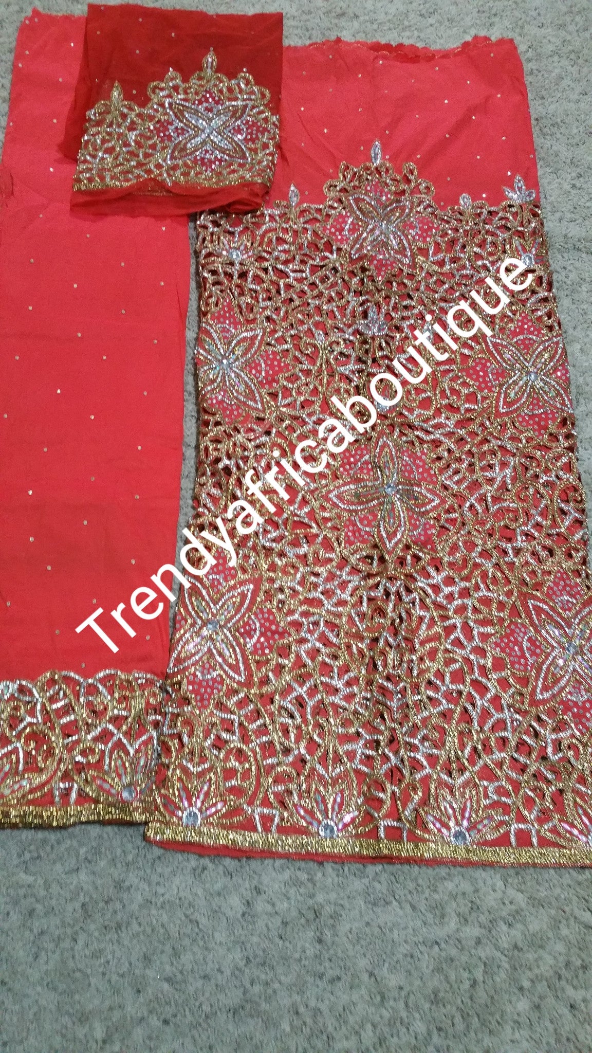 Heavily Beaded/stoned VIP Nigerian/Igbo wedding George wrapper and blouse. Sweet Coral color perfect with gold/white crystals for that special occasion.5yd + 1.8yds matching blouse
