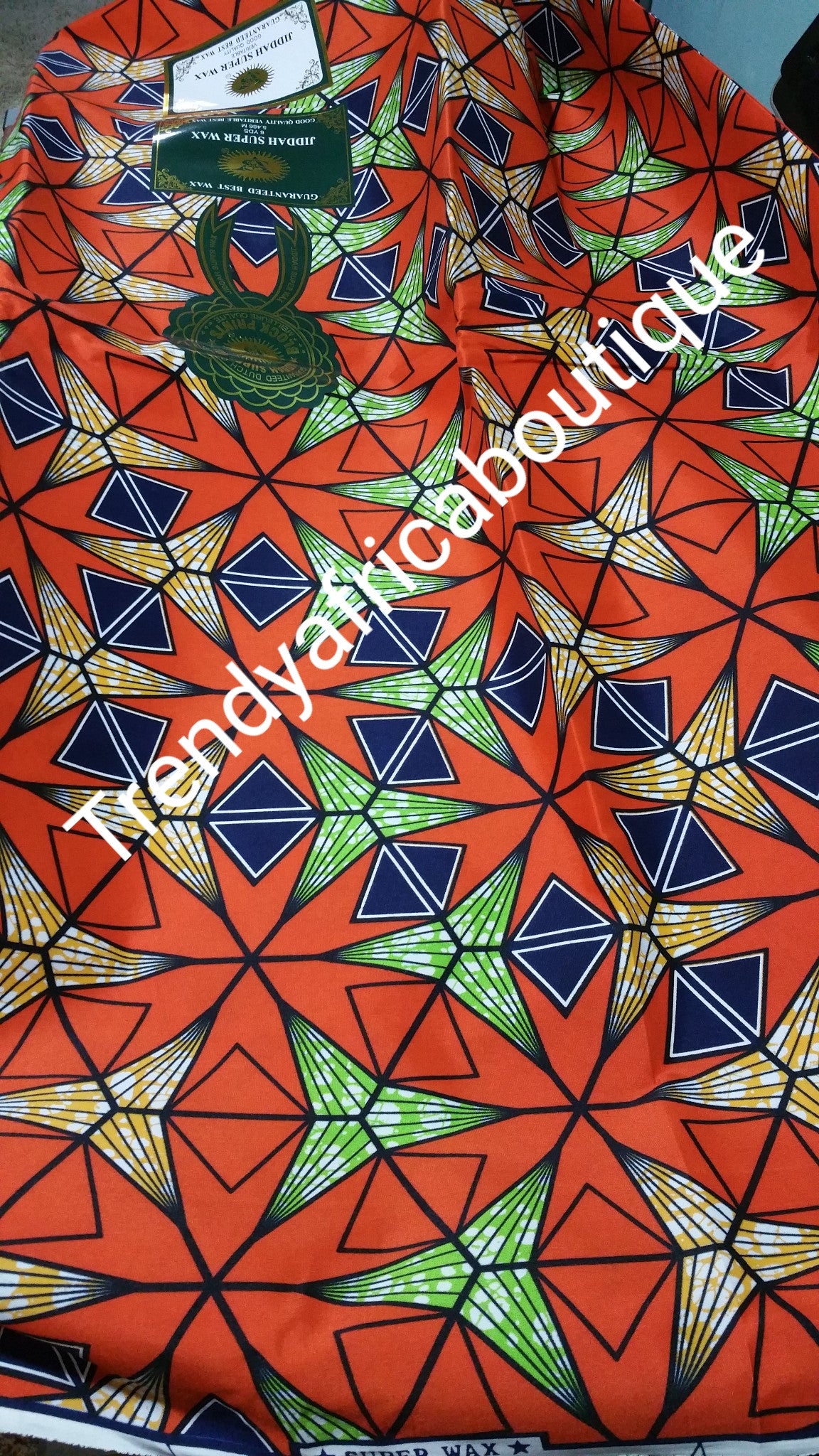 Veritable African Cotton wax print fabric. 100% cotton. Orange color. 6yrds per each length