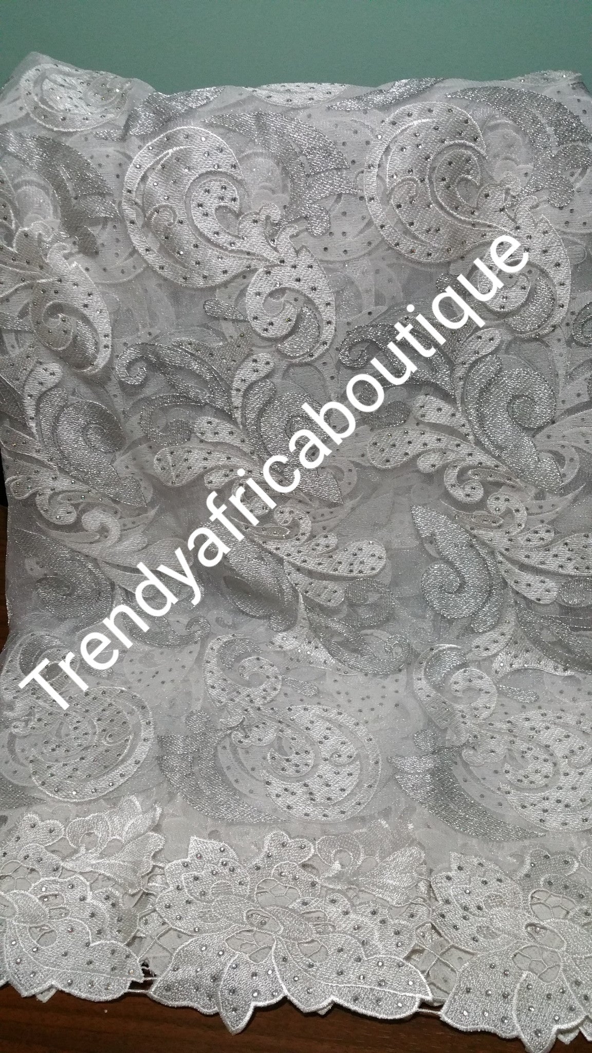 CLEARANCE ITEM: white French lace fabric with silver lurex and all over crystal stone work. Sold 5yards length