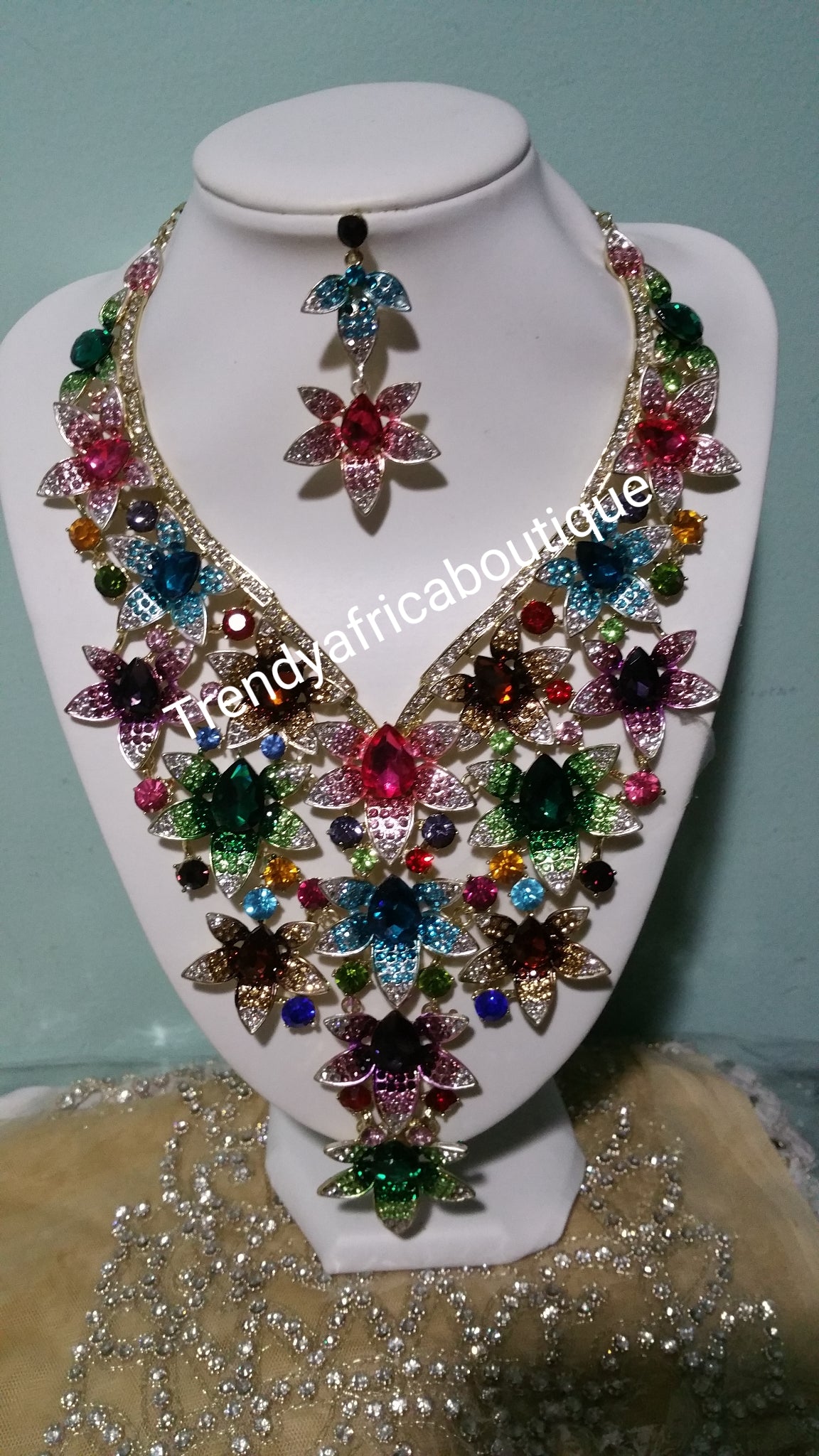 Latest assorted colors of Crystal necklace set for weddings/big event. Beautiful  necklace and matching earrings. Costume jewelry set in dazzlying crystal in 18k gold plating