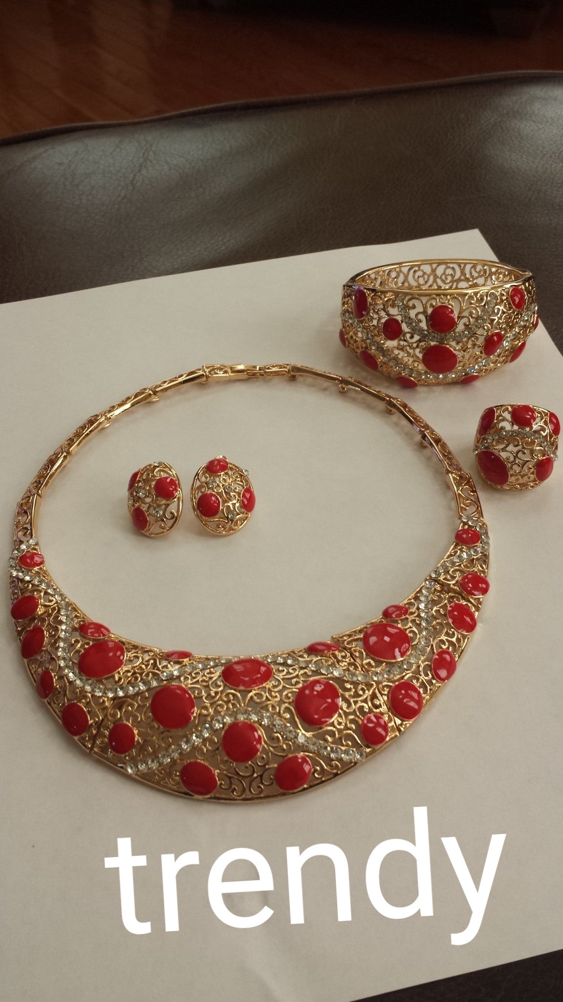 4pc omega necklace set.  18K gold plating with Red beads accent. Hypoallergenic quality
