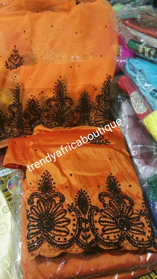 Clearance sale: Exclusive Design of Nigerian Traditional wedding George wrapper in Orange  with black beads/stones all over. Quality hand stoned Silk George sold as 5yds with 1.8yds. matching blouse. Price is for the set