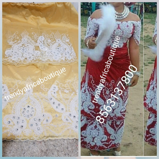 Light Gold Nigerian Traditional wedding George wrapper for special occasion. quality Silk George and matching net blouse beaded and hand stoned  work to perfection. Sold per set of 5yds wrapper and 1.8yrds blouse fabric