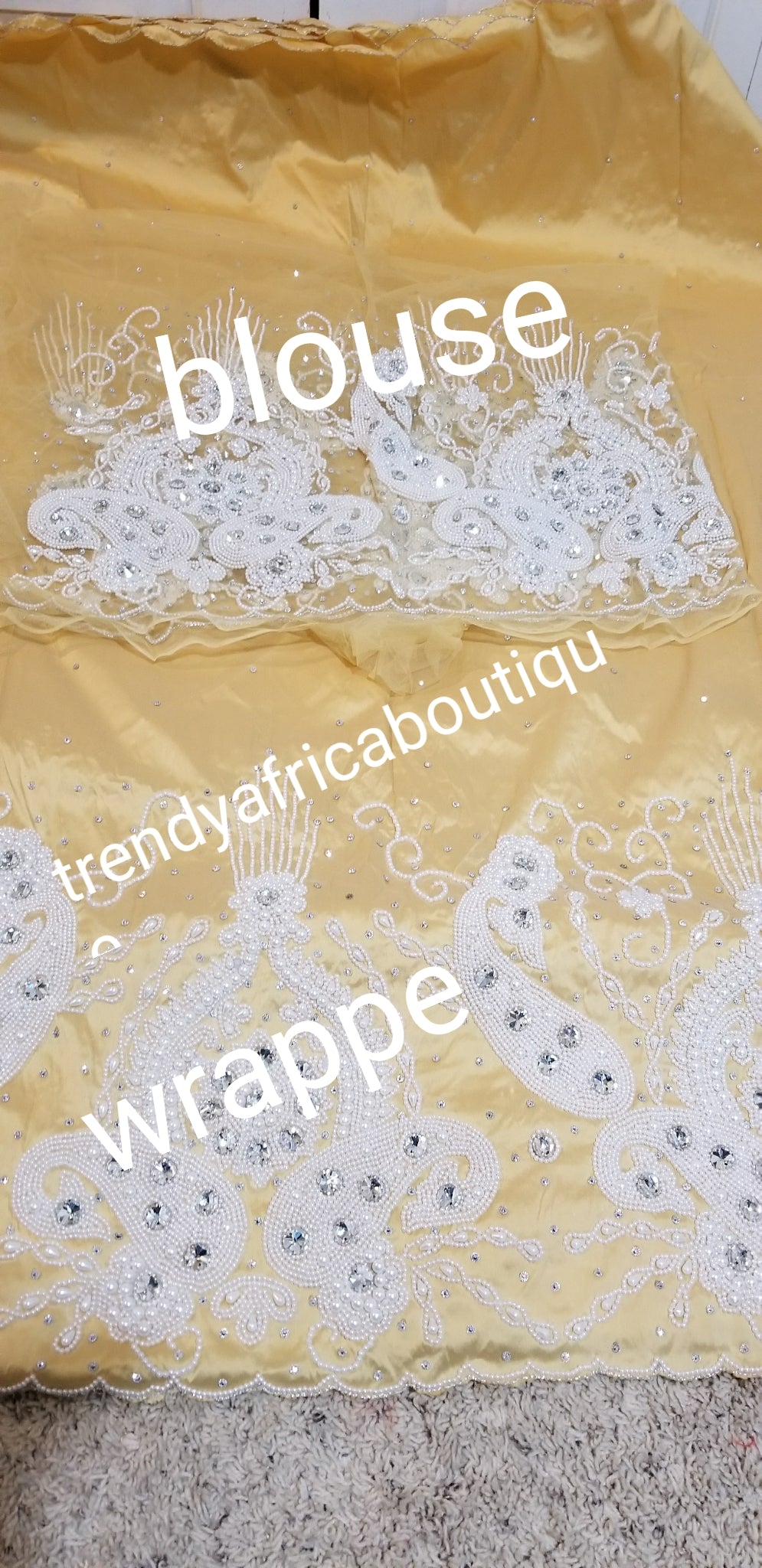 Light Gold Nigerian Traditional wedding George wrapper for special occasion. quality Silk George and matching net blouse beaded and hand stoned  work to perfection. Sold per set of 5yds wrapper and 1.8yrds blouse fabric