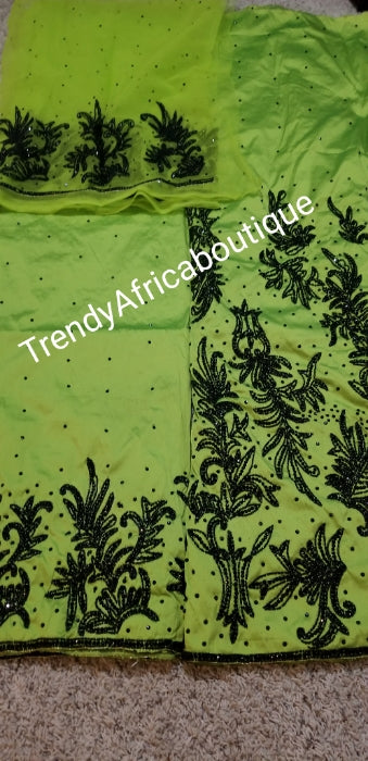 New arrival super  VIP Quality Silk George wrapper. Lemon Green/black hand stoned beads. 2.5yds full bead work and 2.5yds border bead work with matchimg net blouse. Sold as a set