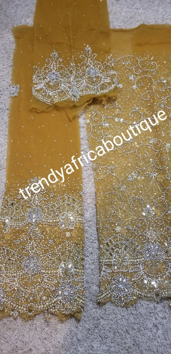 Produce-per-order Gorgeous hand beaded and stoned Igbo Traditonal Bridal wedding George Wrapper and matching net blouse. Full 2.5yds hand stoned + 2.5yds border stoned work + 1.8yds matching net blouse. 3-4 weeks to produce any color of your choice