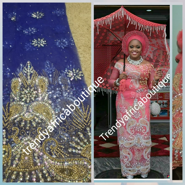 Copy of Clearance Sale: Gorgeous Navy Blue Igbo Traditional Bridal net George wrapper and matching net blouse. Supper quality hand beaded and stoned work. Sold per set of 5yds and 1.8yds matchimg blouse. Model is wearing same design in Coral color