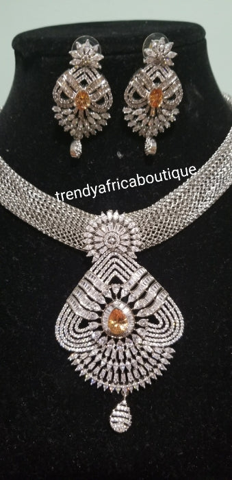 2pcs set 22k electroplated Dubai Gold. Sold as necklace and matching earrings.  Silver set with gold CZ stones