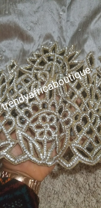 Clearance: Gray  VIP handcut border  George wrapper with crystal stones. Delta/Igbo women George wrapper with matching white net for blouse. Quality cut and stoned work. On clearance. 5yards George wrapper and 1.8yds white contract blouse