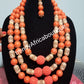 New arrival Edo round coral-necklace set. Traditional Bridal wedding Coral beads  long row in 3 pce. earrings and double Bracelets. Exclusive Nigerian Native bead design with gold accessories sold per set. Bridal-accessories