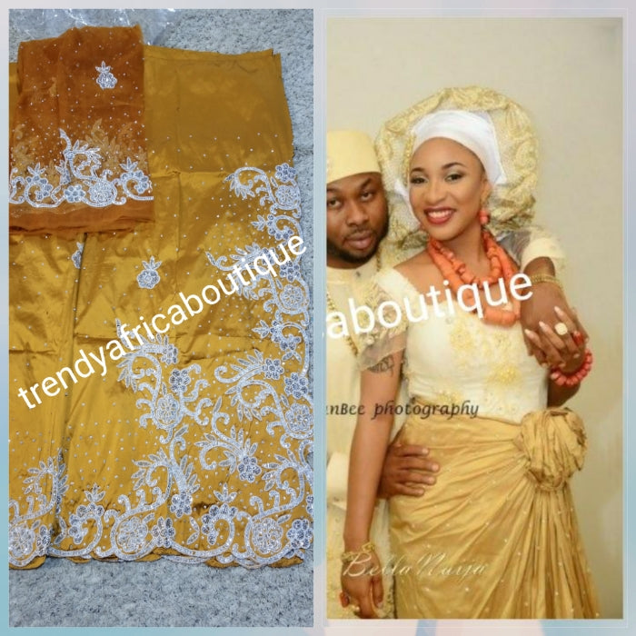 Exclusive design. Gold silk George wrapper beaded and stoned with whit ...