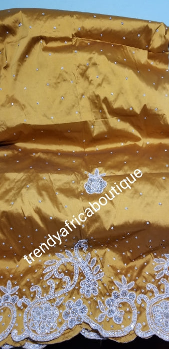 Exclusive design. Gold silk George wrapper beaded and stoned with whit ...