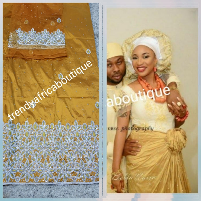 New arrival Gold George wrapper for special occasion. Nigerian traditional wedding/special occasion George. Sold 5yds + 1.8 yards macthing net George.  This is simply quality silk George you can't afford to miss