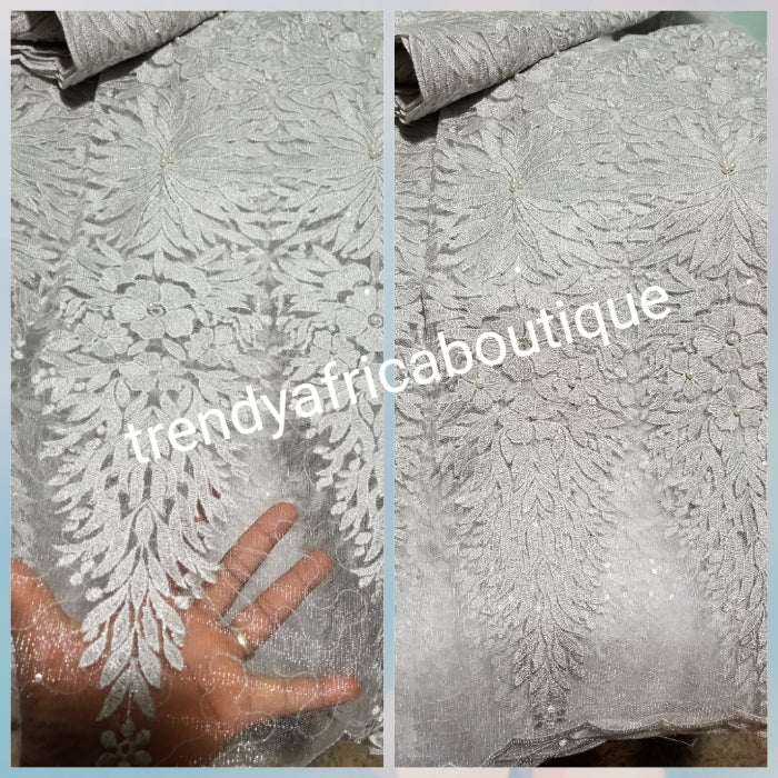 Sale: New arrival Classic white/silver sparkles African  French Lace fabric. Beautiful quality, Unique design for making wedding dresses, Nigerian party dresses. Sold per 5yds. Model show wearing magenta color