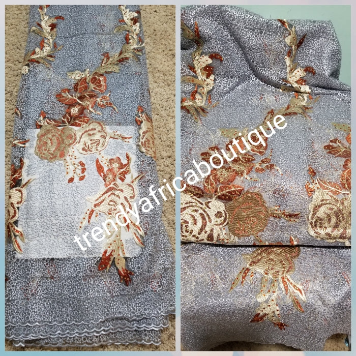 New Arrival  Big Quality African French lace Fabric. Soft texture, excellent embriodery work. Rear color combination. Gray color fabric accent with Burnt orange/champagne embriodery. Sold per 5yards.Nigerian Celebrant fabric