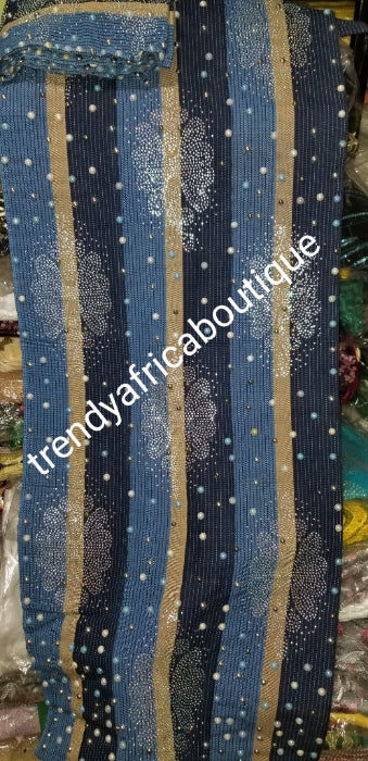 Navy/royalblue/champagne gold Beaddazzled Aso-oke set. 3pcs set for Gele/ipele (shoulder shawl) and a piece for making men cap. Sold as a set. Price is for set. Nigerian Celebrant Aso-oke from Nigeria. Quality beaded and flower stone work