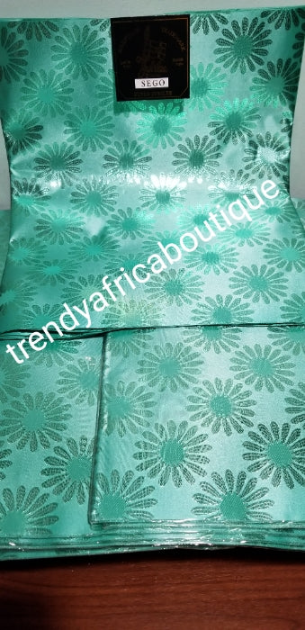 Mint Green sago 2 in 1 packet for making gele/head wrap. Nigerian traditional head wrap for party use. Create a beautiful Gele/headwrap with one of these sago. Sold as a set.