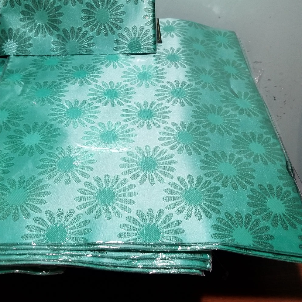 Mint Green sago 2 in 1 packet for making gele/head wrap. Nigerian traditional head wrap for party use. Create a beautiful Gele/headwrap with one of these sago. Sold as a set.