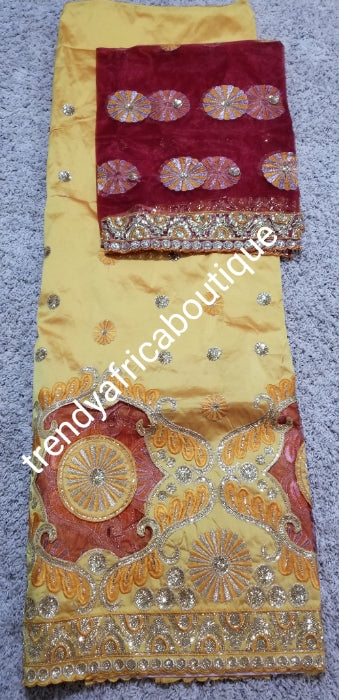 Gold silk George fabric. Embriodered/sequence with wine matching net blouse. Sold as a set. Indian-George use for Nigerian wrapper, skirt/ blouse or dresses. Aso-ebi George