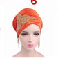 Velvet women-turban embroidered with crystal stone art work on the side for a more creative hair wrap. This is orange color.