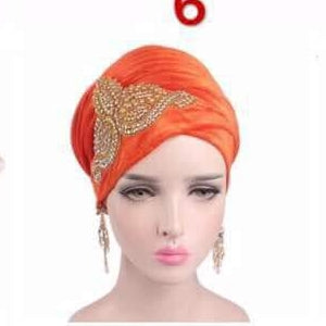 Velvet women-turban embroidered with crystal stone art work on the side for a more creative hair wrap. This is orange color.