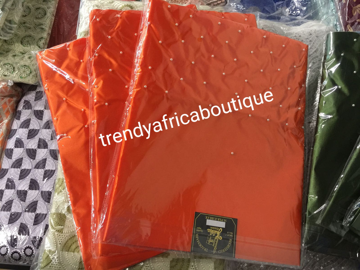 New arrival Orange sago for making gele/headwrap. Embellish with pearl border, great quality, easy to make into gele Nigerian traditional headtie. Sold as a park of 2