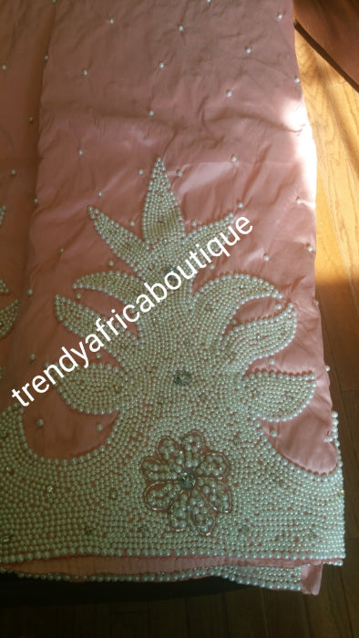 On sale: Latest Design of taffeta Silk George wrapper fabric in Peach color. Classic design Nigeria/Igbo Celebrant George. Hand beaded and stoned to perfection. 5yds + 1.8yrds matching Blouse