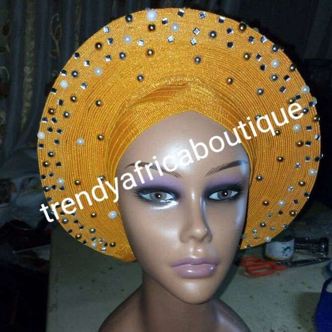 Gold Auto-gele made with quality Aso-oke. Beaded and stoned quality hand work. One size fit, easy to adjust for fit and knot at the back
