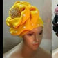 Assorted colors women-turban. One size fit hair turban. Beautiful flower design with a side brooch to add decor to your turban