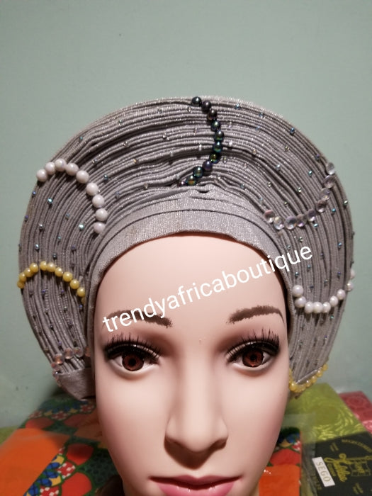 Gray Auto-gele made with quality Aso-oke. Beaded and stoned quality hand work. One size fit, easy to adjust for fit and knot at the back