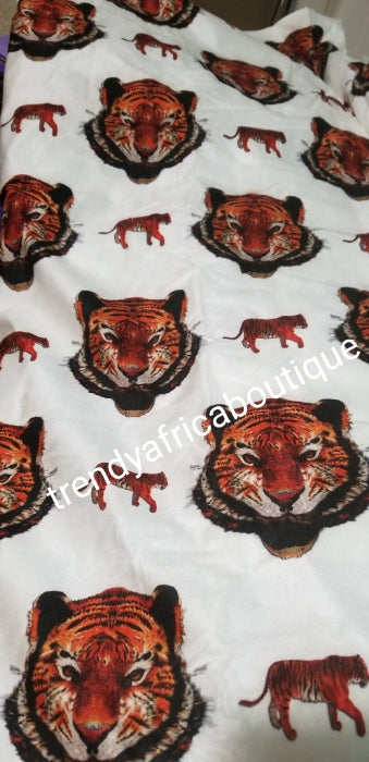 New arrival Isi-agu Igbo traditional/ceremonial fabric for men or womem. Tiger head fabric. Sold per one yard. Price is for a yard. Can be use for wrapper, blouse or shirt for men. White background with black/red tiger head