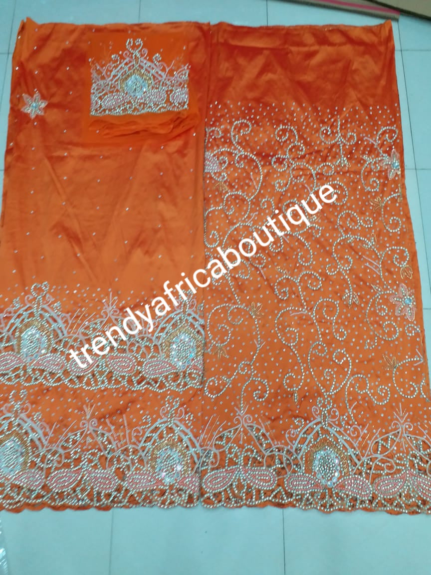 Clearance: Quality Orange VIP George for Nigerian/Igbo/delta Traditional weddings/birthdays and more  wrapper + 1.8yds net fabric for making blouse. Sold as. A set of wrapper and blouse. Original quality silk. "Feel the difference in Quality"