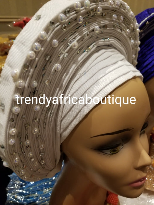 Pure white Auto-gele. Nigerian aso-oke made into auto gele. beaded and stoned to perfection.  Party ready in less than 5 minutes. One size fit, easy adjustment at the back. Made with quality aso-oke. Big design with white beads and stones