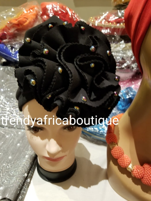 Black women-turban. One size fit hair turban. Beautiful flower design with a side brooch to add decor to your turban