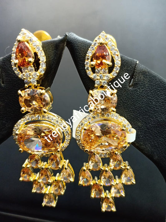 22k electroplated America Diamond-earings. Hand set with quality dazzling gold CZ stones. Original quality, hypoallergenic. Light weight drop-earrings. Beautiful bridal accessories