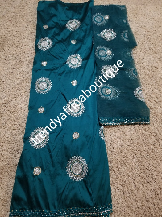 New arrival: Nigerian/Igbo/Delta Traditional George wrapper +blouse. Embellished with crystal stones. Teal green wrapper and net blouse. Beaded and stoned. -George and hand stoned quality taffeta silk
