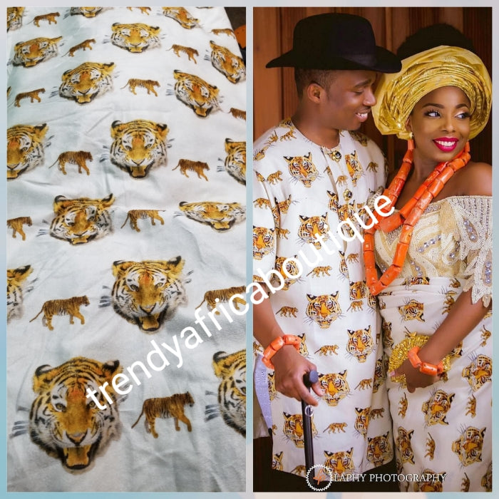 Sale; Original quality white/Gold Isi-agu wrapper, Igbo traditional wrapper use by men or women. Sold per yard, price is for one yard. Nigerian/igbo ceremonia fabric. Soft texture, authentic isi-agu fabric. Igbo Tiger head fabric.