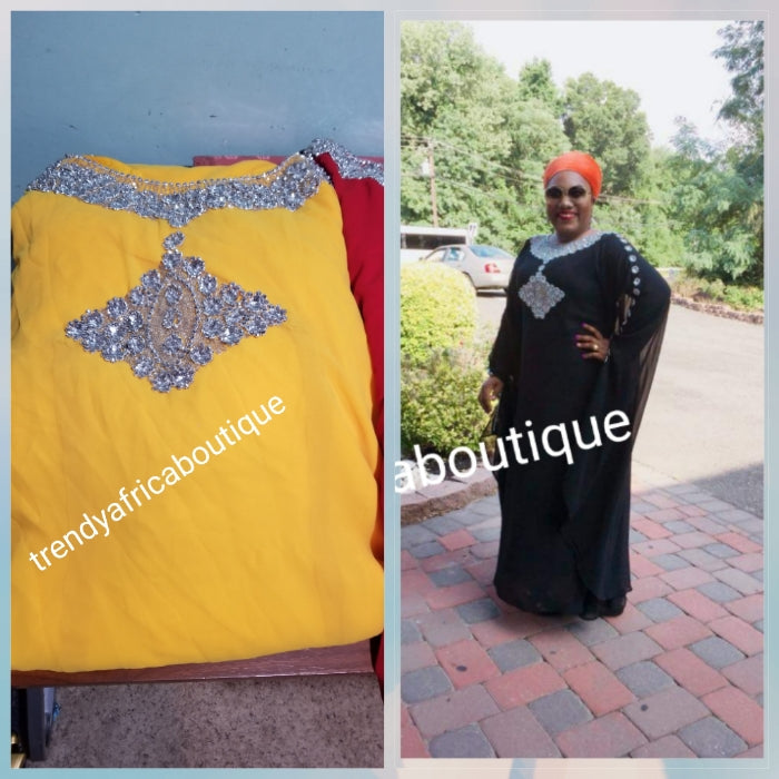 Classic Yellow Dubai long free flowing kaftan dress. Stoned with dazzling Crystal stones to perfection and elegance. Available in XL and XXL. Model is wearing same dress in black