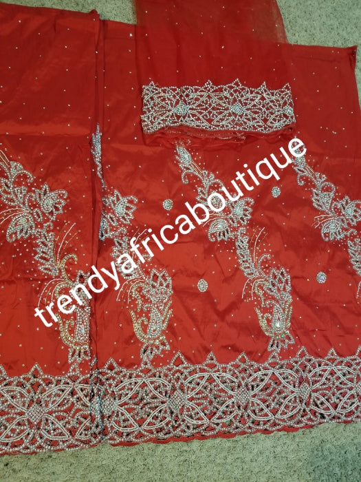 New arrival:Red VIP Celebrant Nigerian women George wrapper. Niger/Igbo/delta traditional wedding George hand stoned with dazzling crystal stones to perfection. for special occasion. 2.5yds + 2.5yds + 1.8yds net blouse. Beautiful handcut work