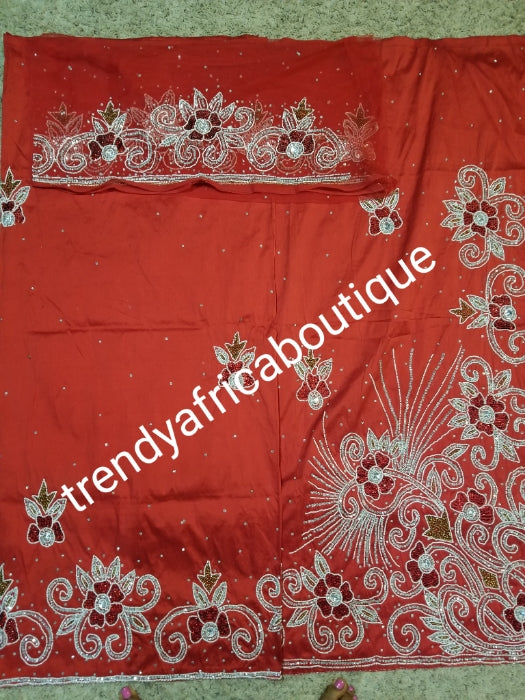 quality Red Nigerian Traditional silk George wrapper. Beaded and stoned in Red color. 2.5yds + 2.5yds and a net fabric for Blouse combinations. Sold as a set. This is special offer george