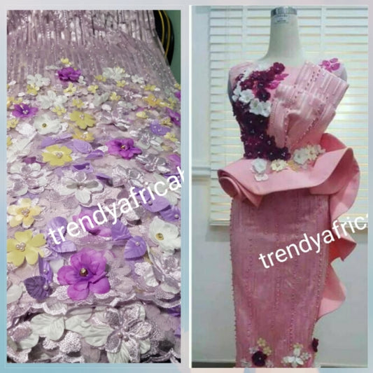 New arrival french lace fabric. Beautiful 3D flower border made to perfection. Ideal for evening gown, or Nigerian traditional wedding outfit. This color is lilac with purple multi color petals. Sold per 5yds