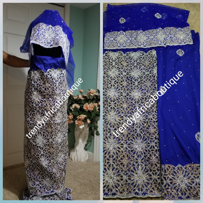 Latest VIP hand cut embriodery Silk George wrapper and matching net blouse. Royal blue George, All Crystal stones to perfection. Quality Guaranteed. 2 wrapper of 2.5yds each and 1.8yds blouse. Nigerian madam George/Igbo Delta women