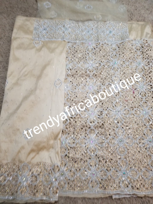 Beige  design  VIP hand cut embriodery Silk George wrapper and matching net blouse. Beige George, All Crystal stones to perfection. Quality Guaranteed. 2 wrapper of 2.5yds each and 1.8yds blouse. Nigerian madam George/Igbo Delta women wrapper
