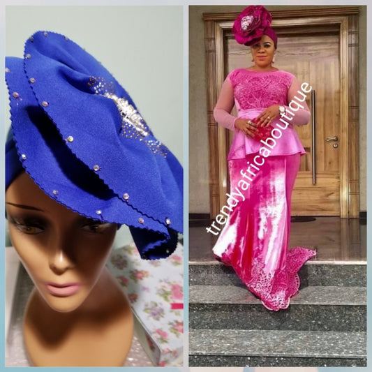 Royal blue color Women-turban. One size fit all turban. Beautiful flower design with a side brooch/ embellished with crystal stones to add decor to your turban