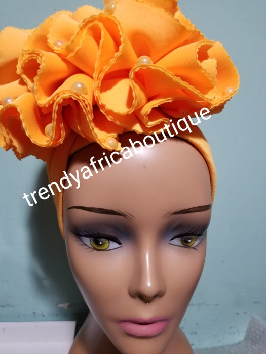 Orange  color Women-turban. One size fit all turban. Beautiful flower design with a side brooch/ embellished with beads to add decor to your turban