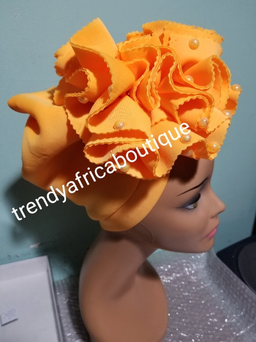 Orange  color Women-turban. One size fit all turban. Beautiful flower design with a side brooch/ embellished with beads to add decor to your turban