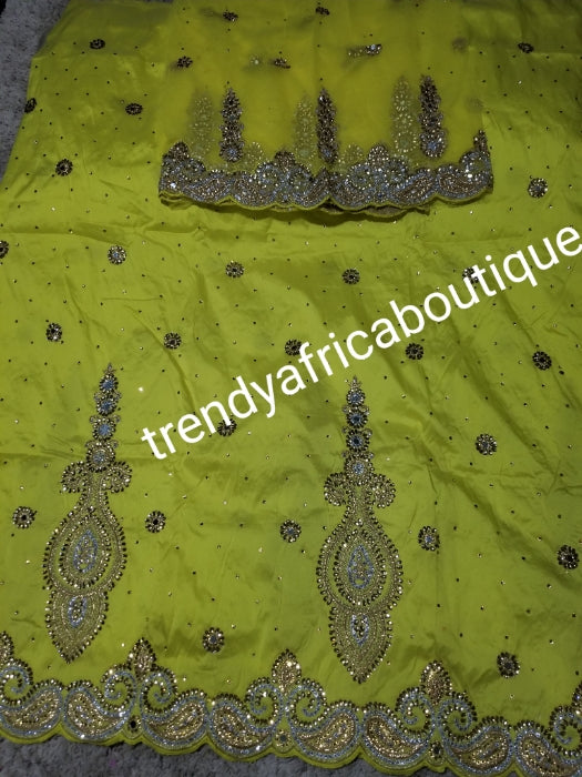 SALE,SALE- New arrival Nigerian Tranditional wedding George wrapper. Embellished with quality dazzling beads/crystal stones design in rich yellow. Full 5yds + 1.8yds matching blouse. Indian-George.