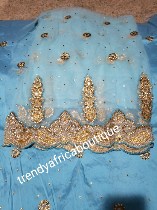 SALE,SALE- New arrival Nigerian Tranditional wedding George wrapper. Embellished with quality dazzling beads/crystal stones design in sweet sky blue. Full 5yds + 1.8yds matchingblouse . Indian-George.